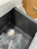 Picture of KRAUS Bellucci Workstation 30-inch Undermount Granite Composite Single Bowl Kitchen Sink in Metallic Black with Accessories